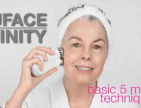 A woman using a NuFACE Trinity Microcurrent Device to remove her wrinkles.